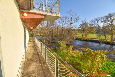 Solid set of buildings by the river