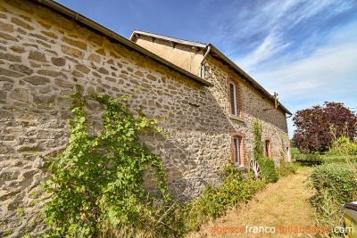 Stately village house with barn