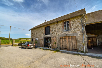 Stately village house with barn