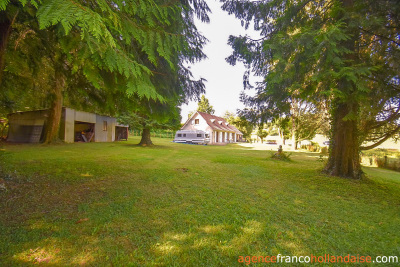 Bungalow with outbuildings and a mature park