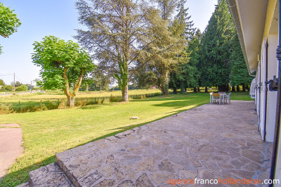 Bungalow with outbuildings and a mature park