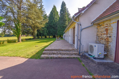 Bungalow with outbuildings and a mature park