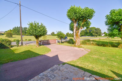 Bungalow with outbuildings and a mature park