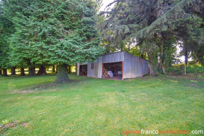 Bungalow with outbuildings and a mature park