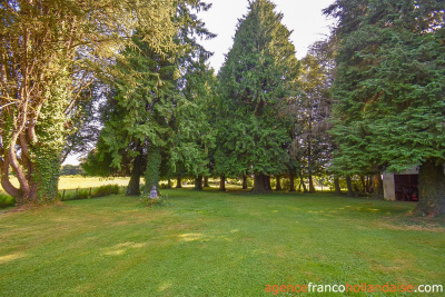 Bungalow with outbuildings and a mature park