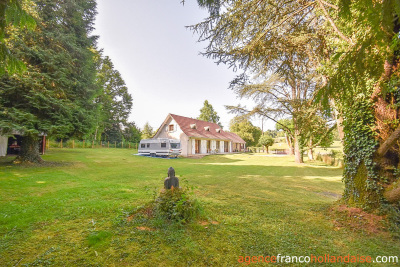 Bungalow with outbuildings and a mature park