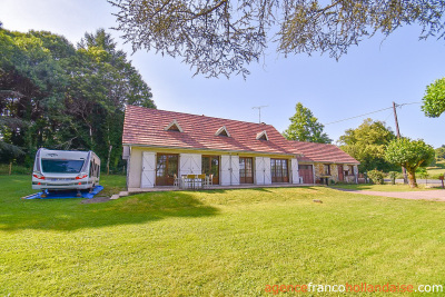 Bungalow with outbuildings and a mature park