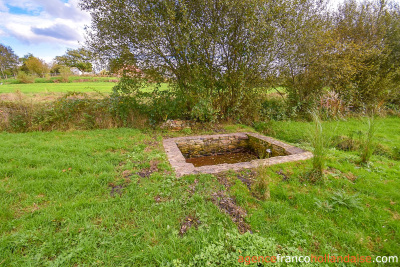 Land and outbuildings in the heart of the village