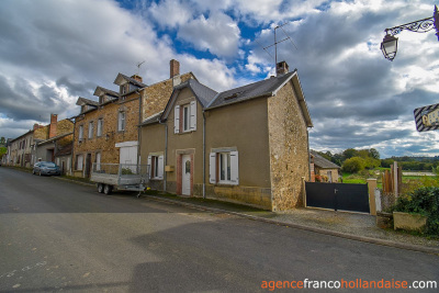 Land and outbuildings in the heart of the village